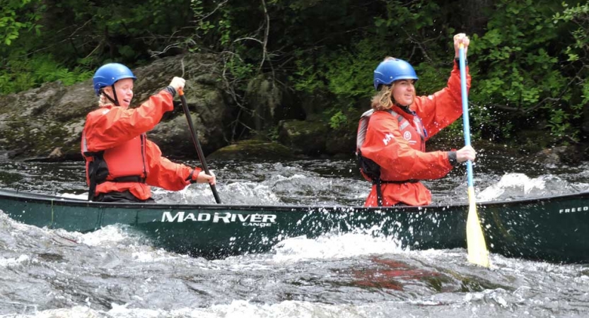 teens whitewater canoeing